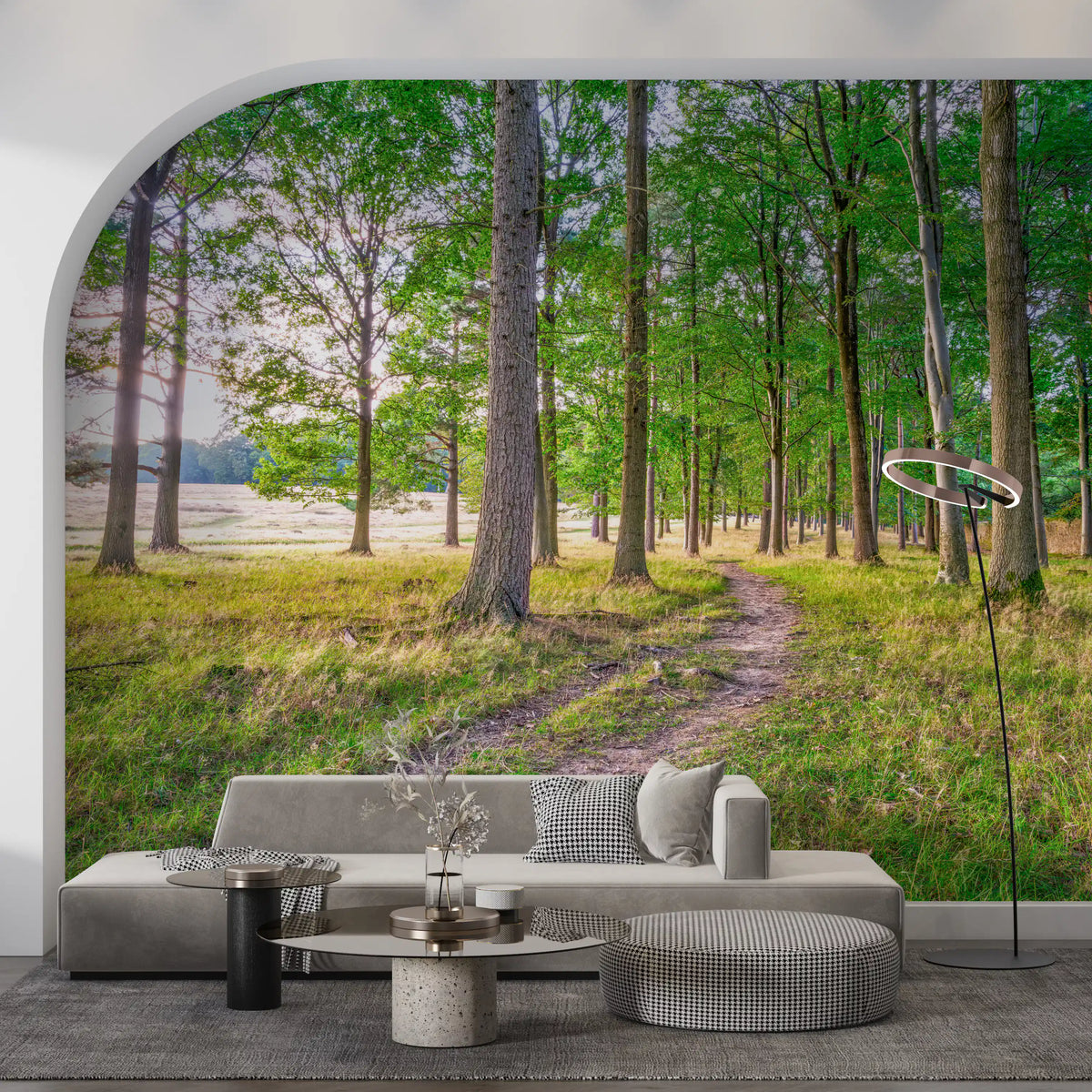 Low gray sofa and houndstooth pouf under an arched wall with a green woodland path mural GD14219