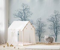 Minimalist tree contours mural with a dramatic red sun design.
