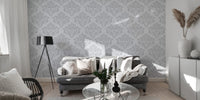 Subtle grey damask repeat wallpaper on a white backdrop.