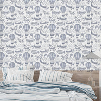 Soft blue wallpaper featuring old-fashioned airplanes

