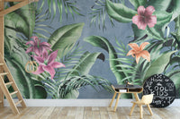 Elegant floral wallpaper mural featuring green leaves on blue.
