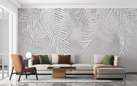 White palm leaves on concrete wallpaper
