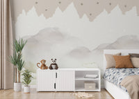 Mountain range mural with cloud-filled sky