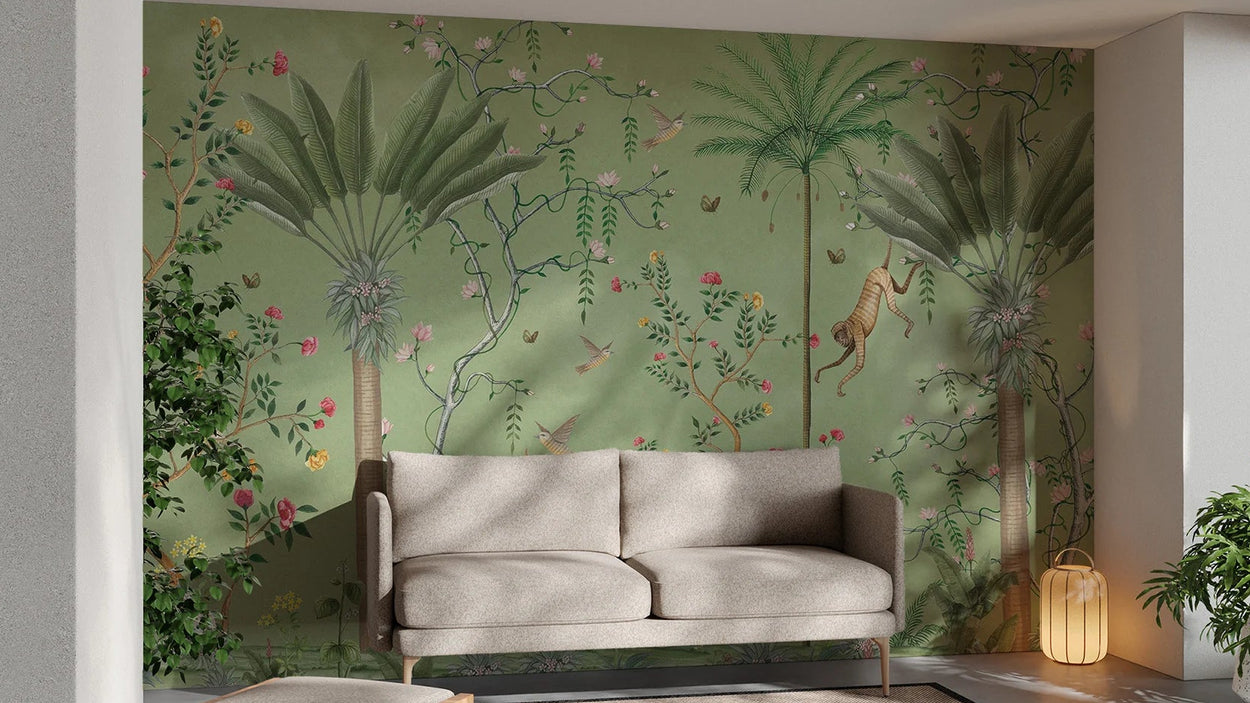 Living room with a sofa against a wall featuring jungle wallpaper for walls.