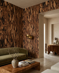 Swirling woodgrain ripples across the Ettore wall mural in a relaxed living room.