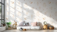 Cream Baby Forest Friends wallpaper of bears and squirrels above a low white daybed in a sunlit kids room