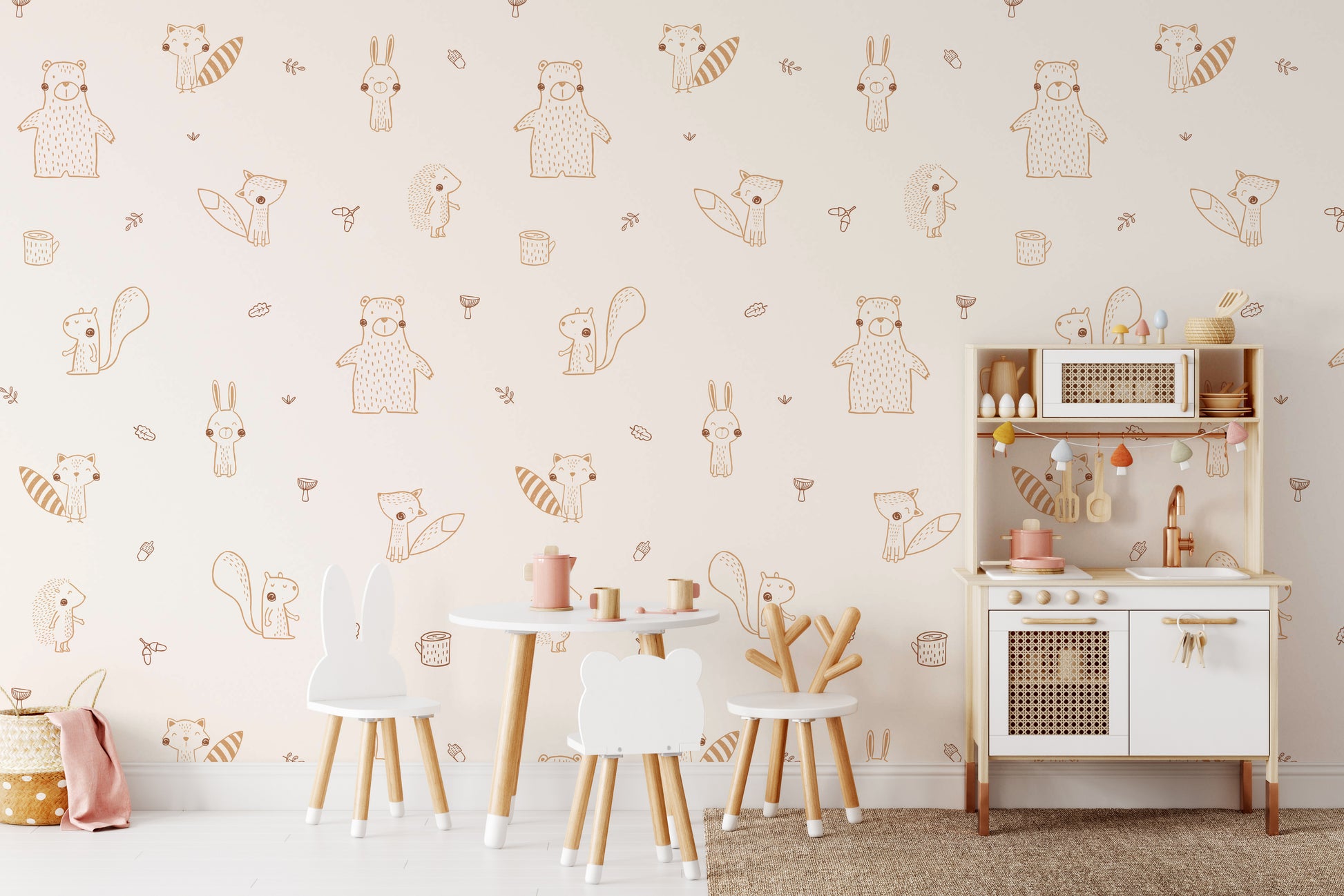 Cream Baby Forest Friends wallpaper behind a kids play table with animal-shaped chairs and a toy kitchen