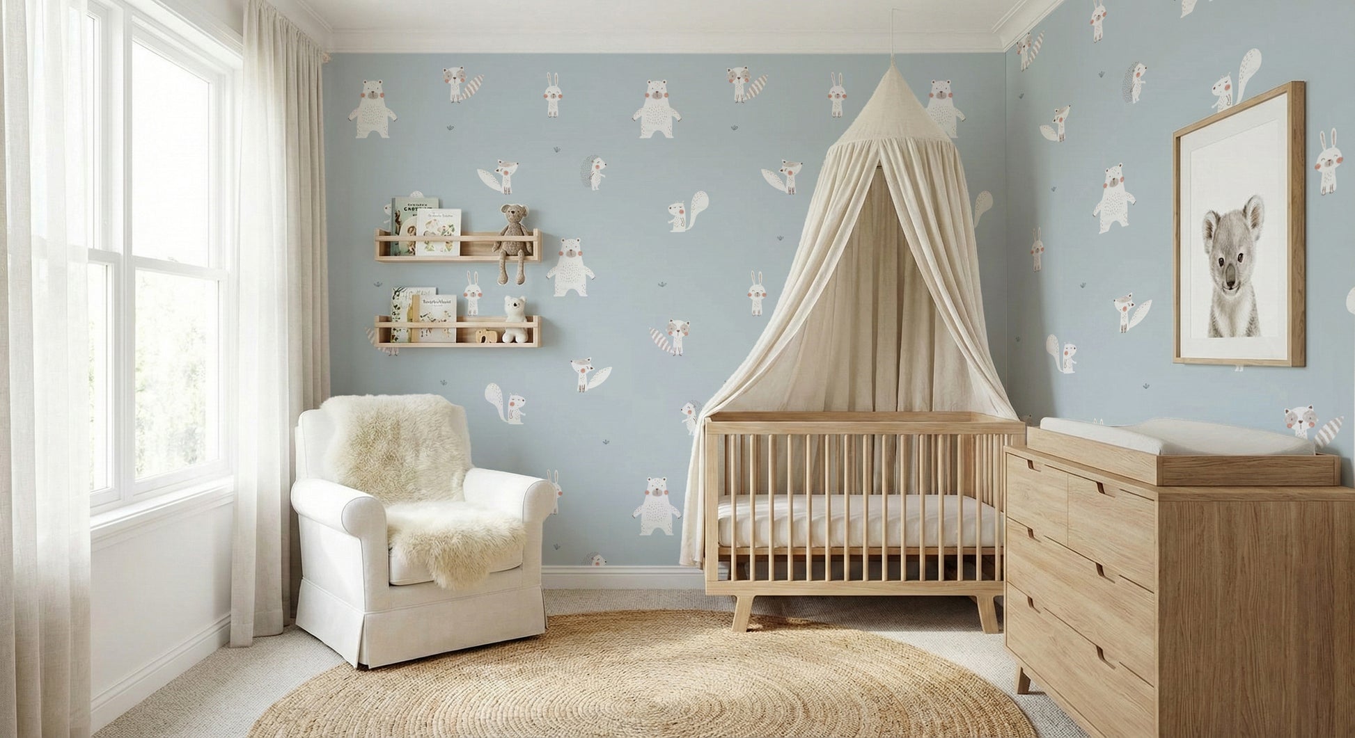 Forest Animals Blue wallpaper with white woodland critters behind an oak crib and canopy in a pale blue nursery