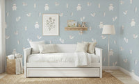 Forest Animals Blue wallpaper of bunnies and squirrels above a white daybed in a light blue kids room