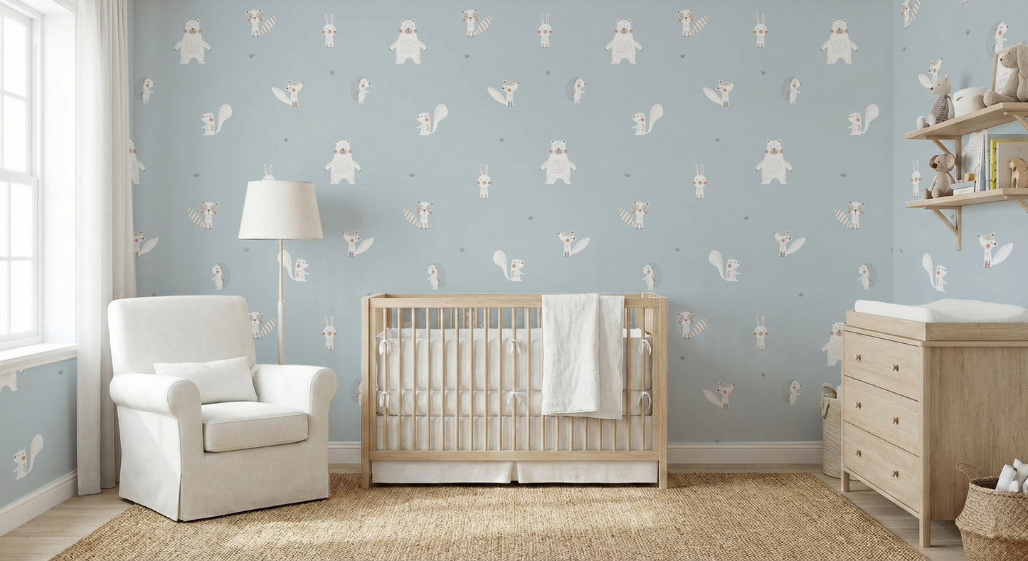 Forest Animals Blue wallpaper behind a pink sofa and white dresser in a playful blue kids room