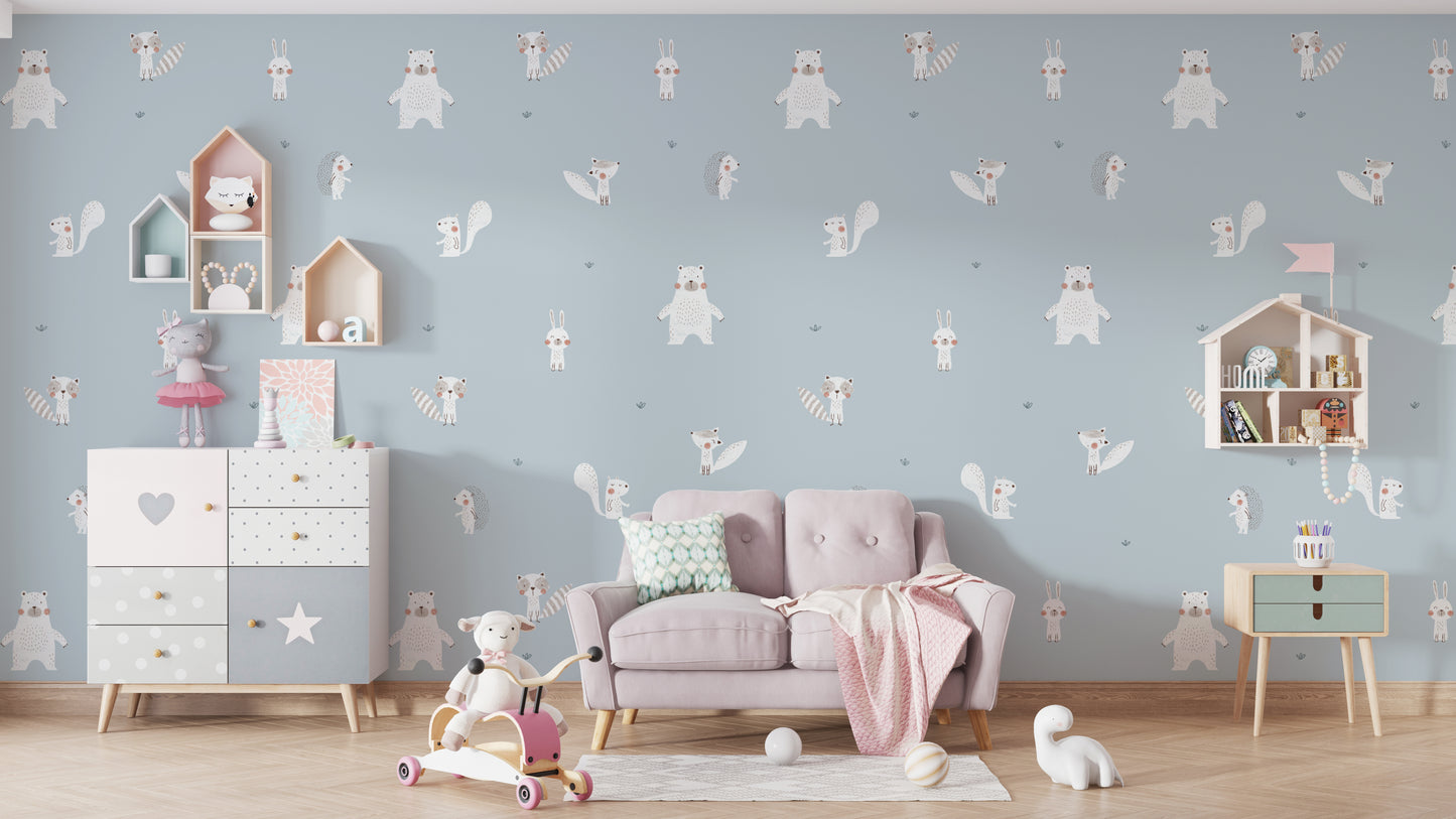 Forest Animals Blue wallpaper of white bears and rabbits behind a wood crib and glider in a blue nursery