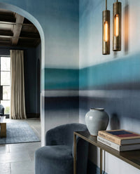 Hallway carrying soft blue horizon stripes from the Rotko Veil wall mural