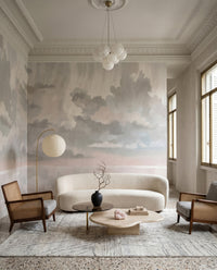 Cloud forms float above a Lounge area with the Velvet Smoke wall mural in muted shades.