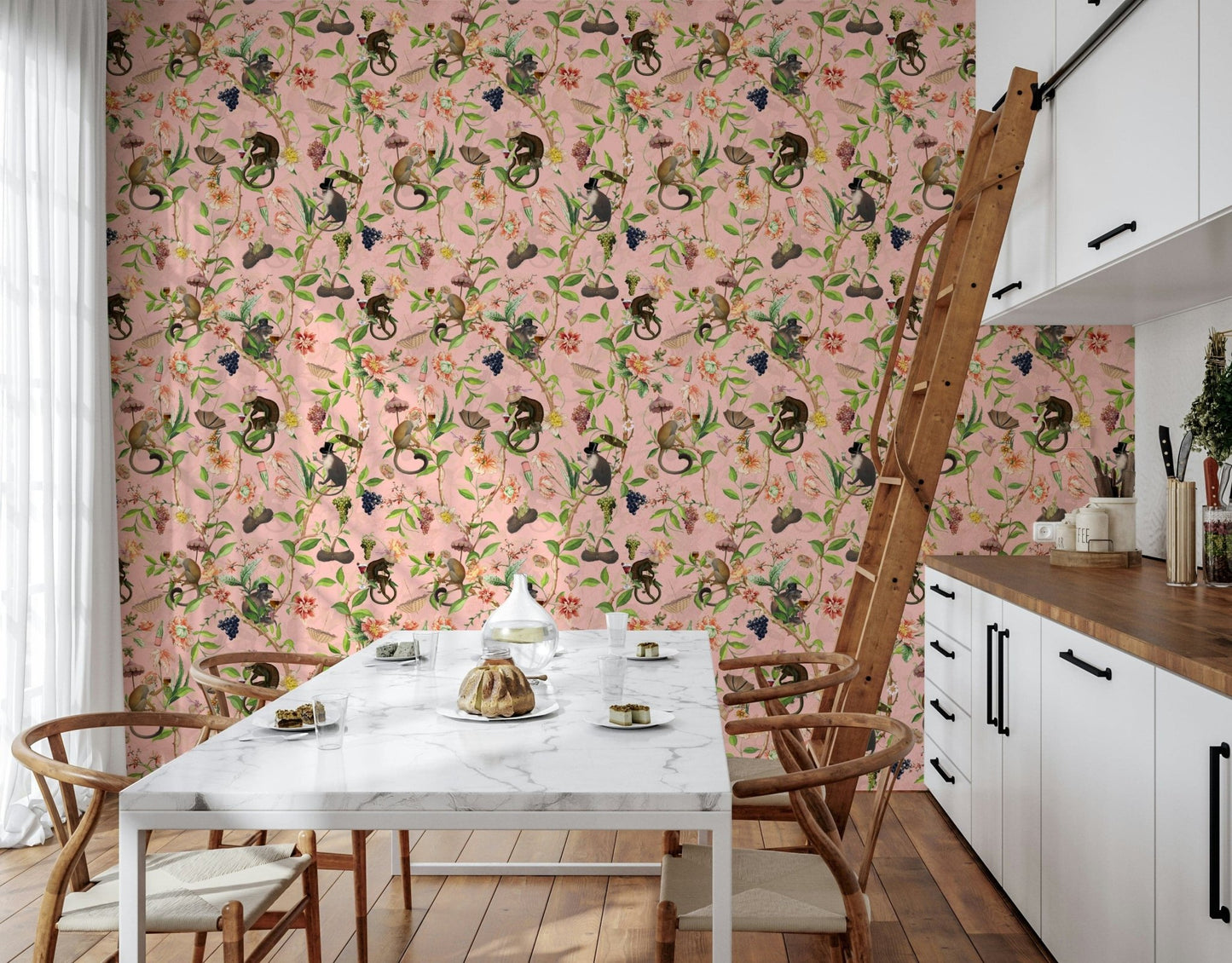 A Primate's Garden Party wallpaper of monkeys and florals in a kitchen nook with marble table and ladder