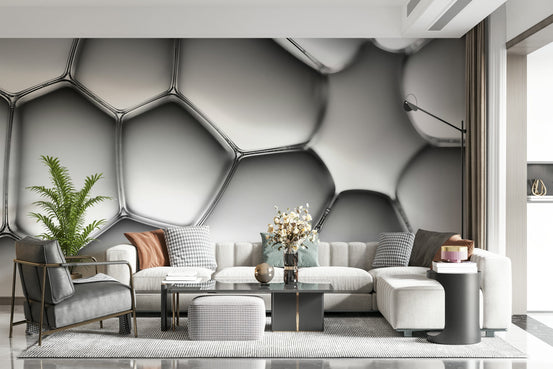 Abstract Cell Structure wallpaper mural in silver 3D bubbles above a white sectional and grey armchair in a living room