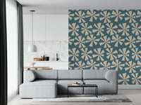Modern retro floral wallpaper with radiating cream petals spread across a teal field.