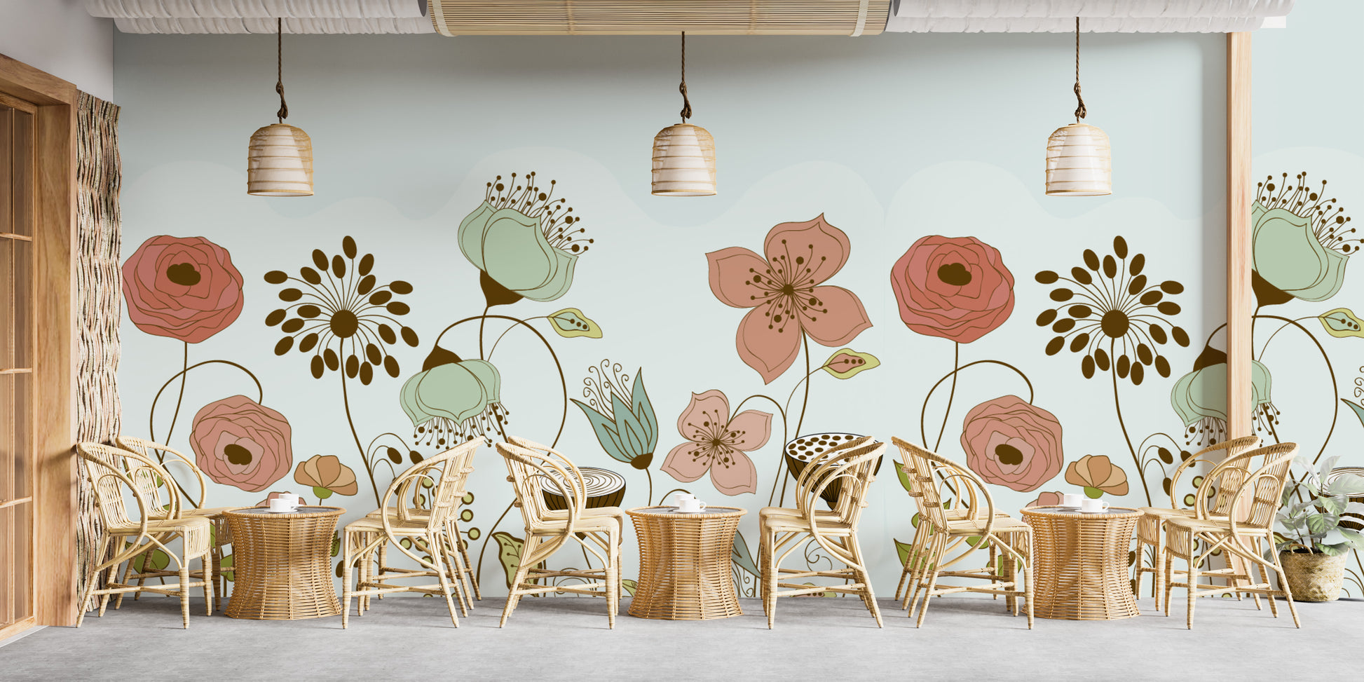 Abstract Flower wallpaper mural of large peach and sage flowers on mint above rattan cafe chairs and tables