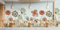 Abstract Flower wallpaper mural of large peach and sage flowers on mint above rattan cafe chairs and tables