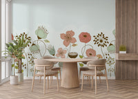 Abstract Flower wallpaper mural of peach and sage retro blooms on mint behind a round wood dining table and chairs