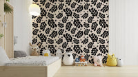 The design features artistic, stylized leaves and plants.

