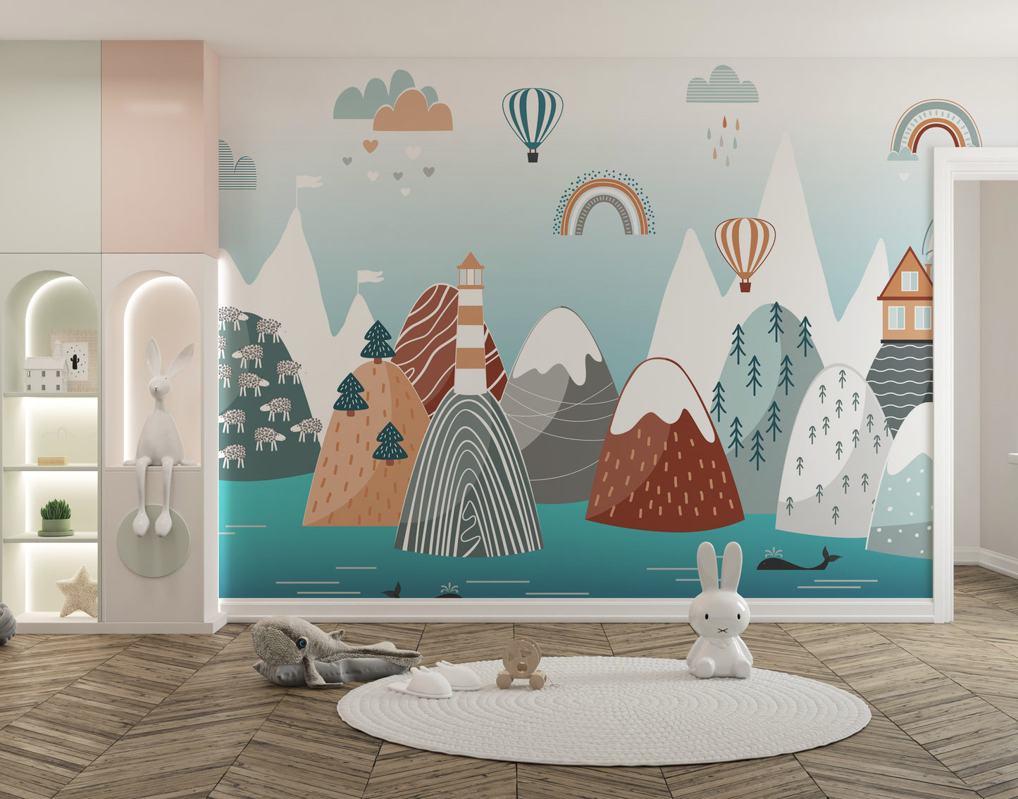 Abstract Mountain with Sea wallpaper in pastel teal with rainbows above a round rug and bunny toys in a nursery