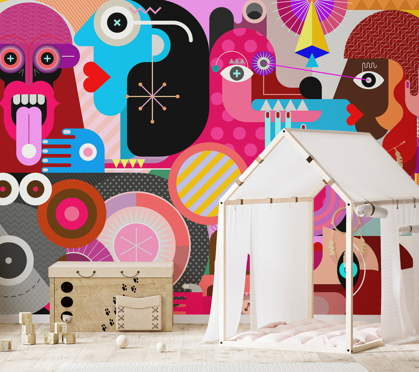 Abstract Pop Art Faces wallpaper mural in vivid pink behind a white play tent and toy chest in a kids room