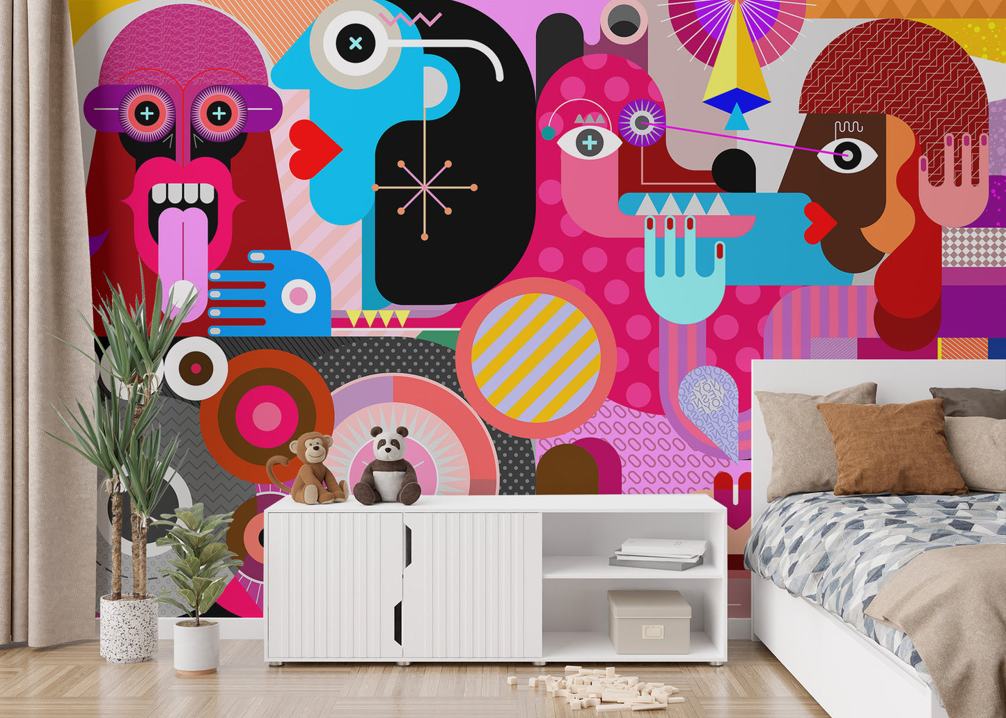 Abstract Pop Art Faces wallpaper mural in bold colors behind a white bed and toy console in a kids room