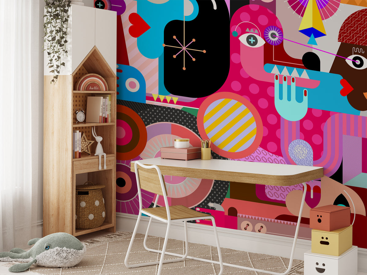 Abstract Pop Art Faces wallpaper mural in bright pink and blue behind a white kids desk and bookshelf