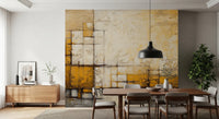Abstract Texture wallpaper mural of mustard and ivory textured blocks above a wood dining table and chairs in a dining room