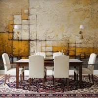 Abstract Texture wallpaper mural with gold and cream impasto blocks above a wood dining table and cream chairs on a Persian rug