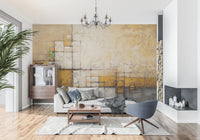 Abstract Texture wallpaper mural with golden plaster grid behind a grey sofa and blue swivel chair under a chandelier