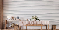 Abstract White Waves wallpaper mural of soft white ridges behind a wooden dining table set with flowers