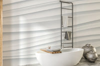 Abstract White Waves wallpaper mural of soft 3D wave ridges behind a white freestanding bath and grey vases