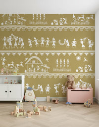 Adivasi Chronicles wall mural with white folk-art dancers and farmers on mustard in a nursery with a toy box