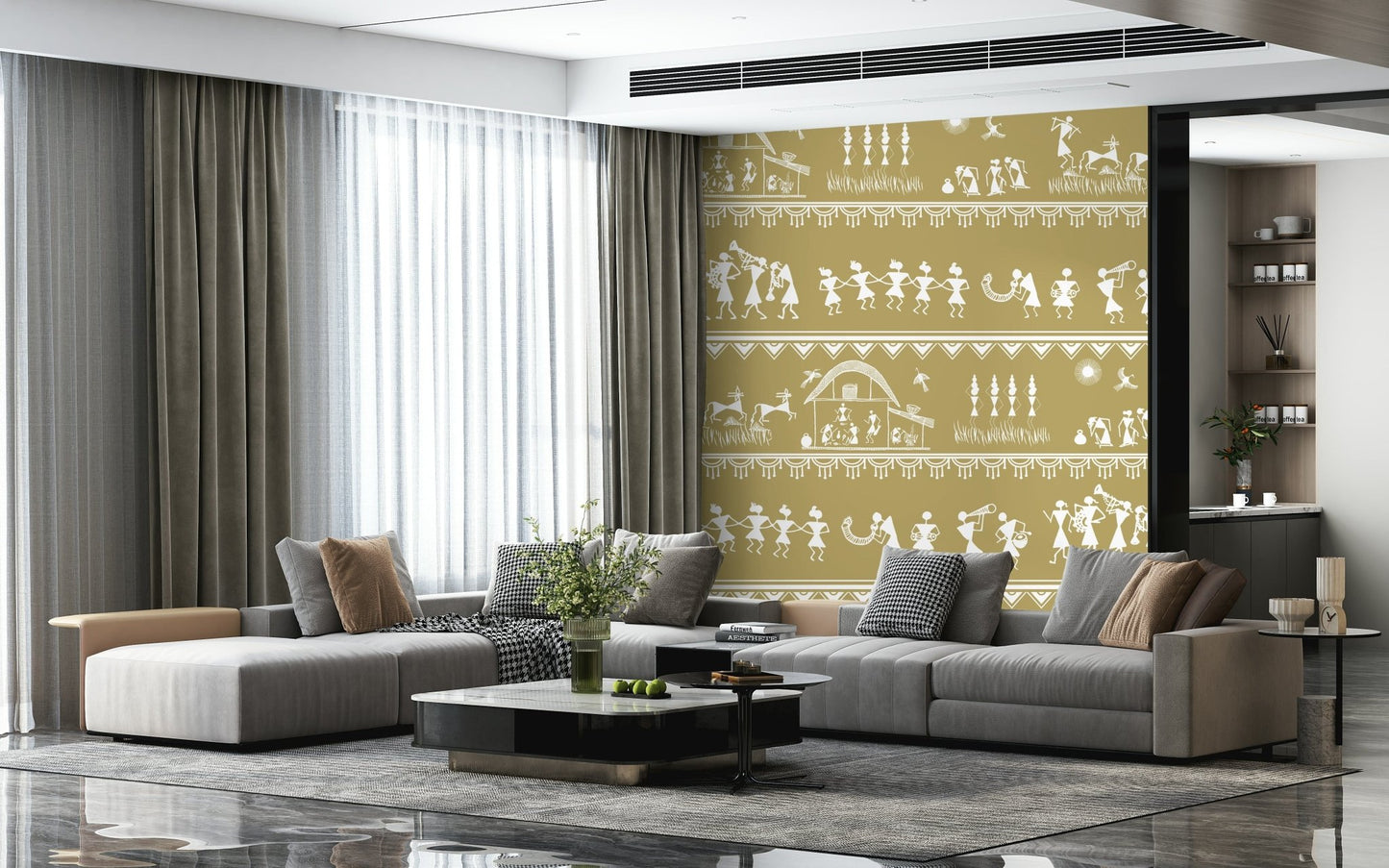 Adivasi Chronicles wall mural of white Warli tribal figures on ochre behind a grey sectional sofa in a living room