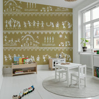 Adivasi Chronicles wall mural of white Warli village life on ochre in a kids playroom with toys and books