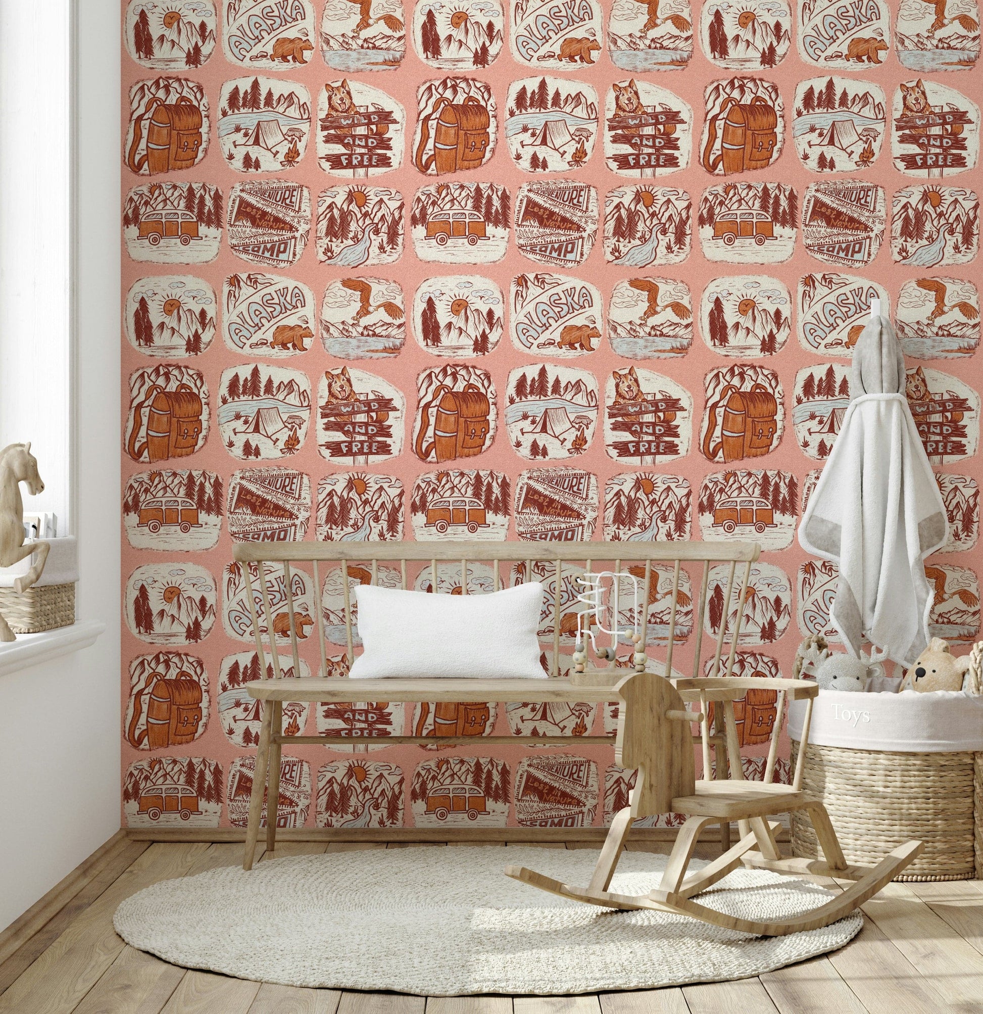 Camping-themed wallpaper mural with sketch-style patches of Alaska scenery, bears, eagles, and vans.