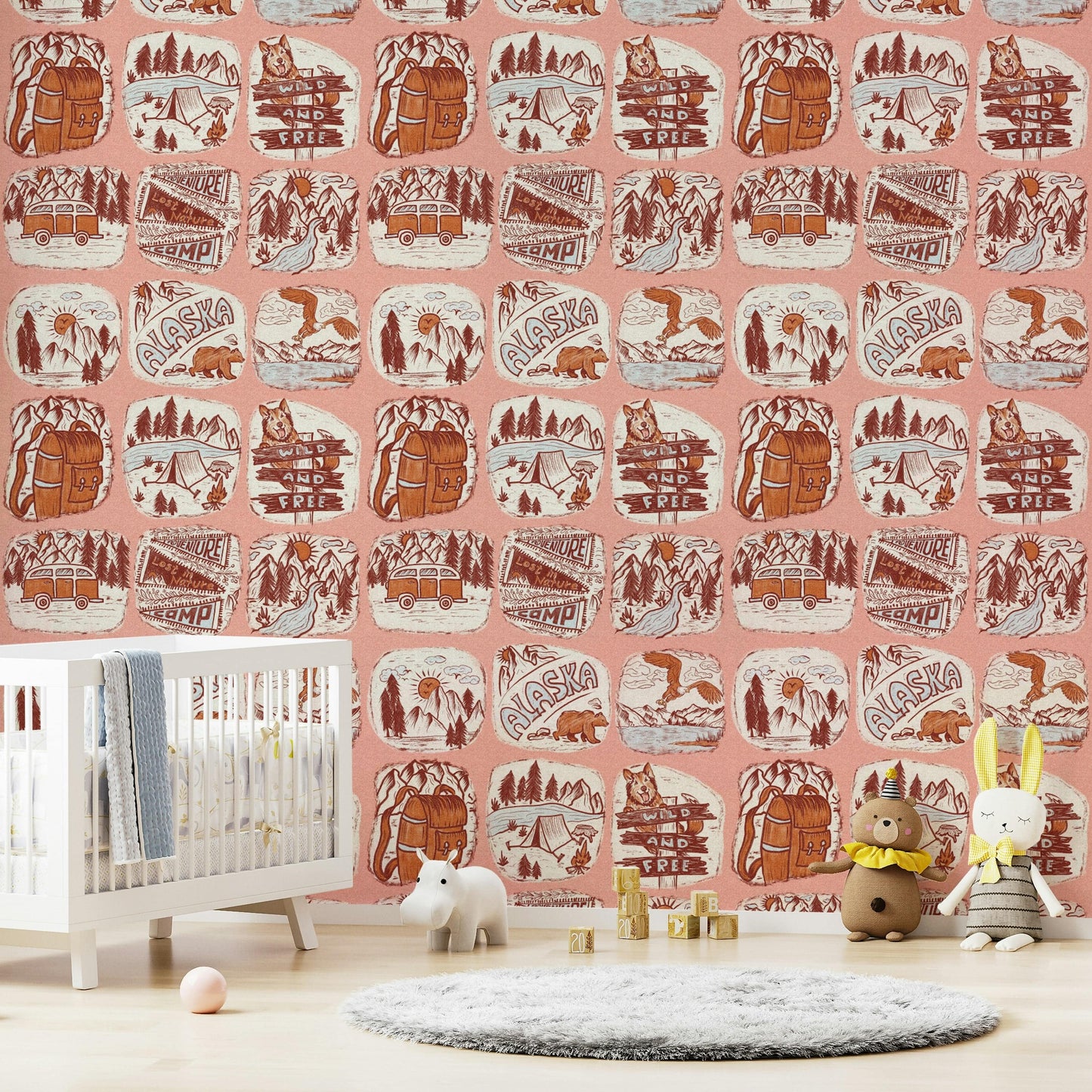 Adventure Awaits wallpaper featuring illustrated outdoor badges with mountains, forests, and wildlife.