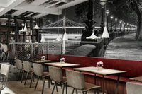 The image shows a full wall with a walkway beside the Thames River.

