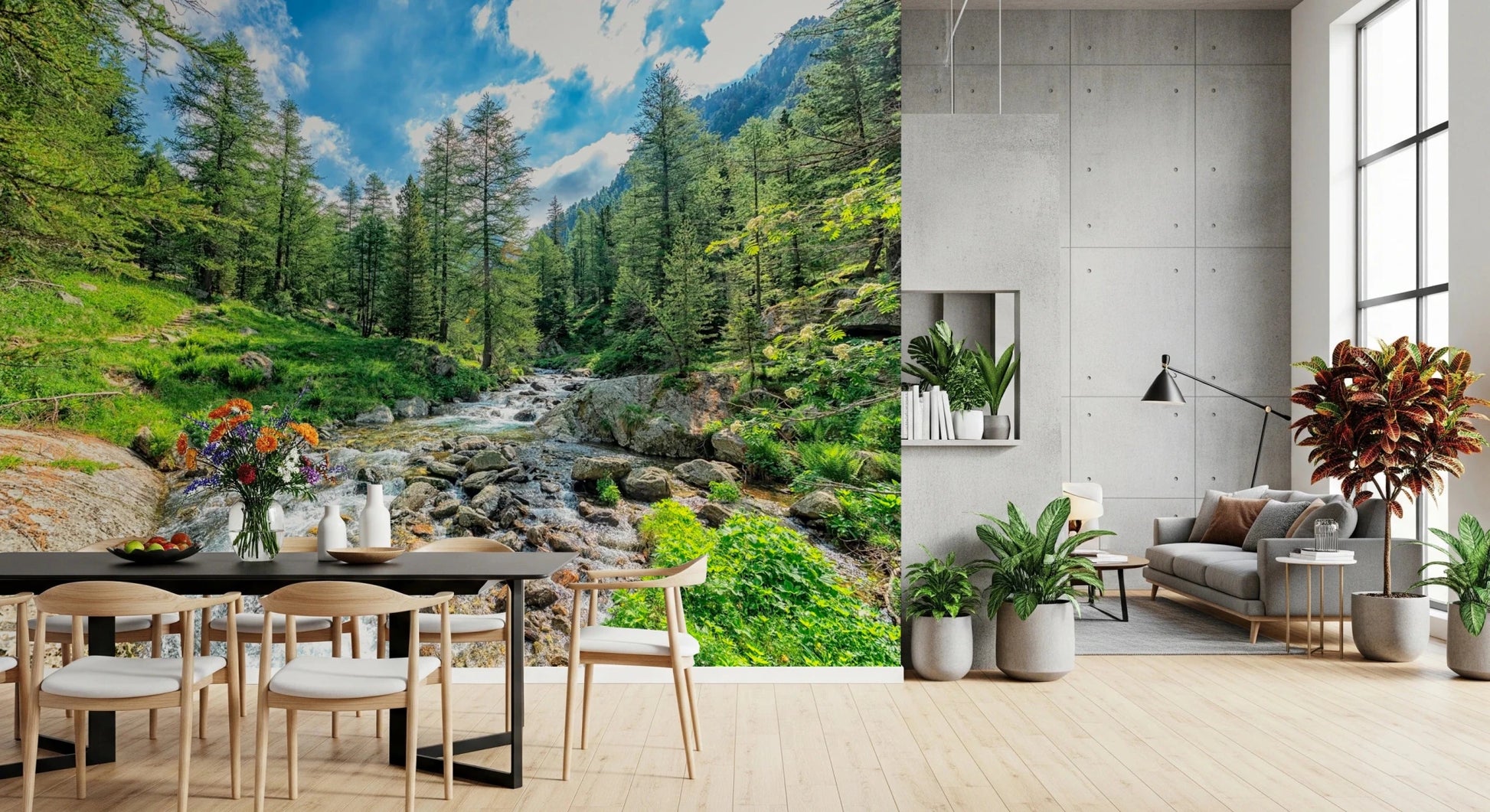 Alpine Stream wallpaper mural of a green forest stream behind a dark dining table in an open living and dining room