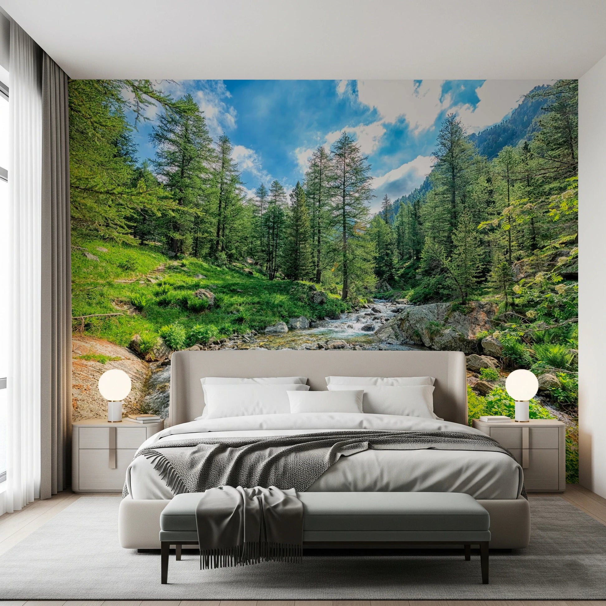 Alpine Stream wallpaper mural of a rocky mountain creek in a forest above a taupe bed in a bedroom