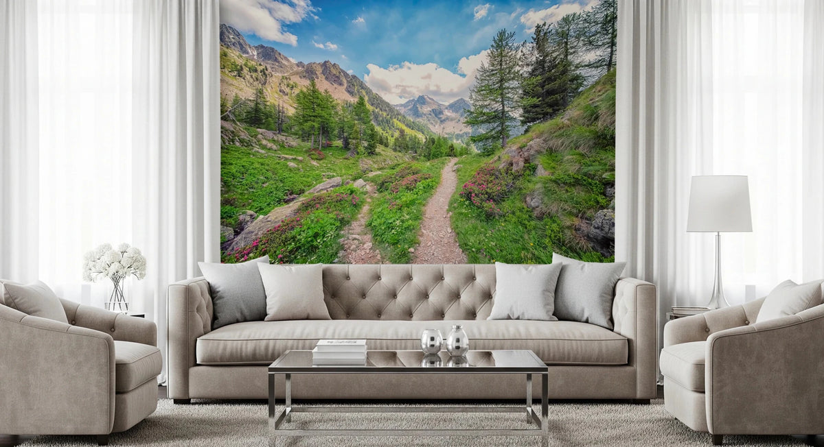 Alpine Trail wallpaper mural of a mountain path through green meadows above a beige tufted sofa in a living room