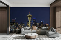 Space Needle silhouette amid glowing urban cityscape


