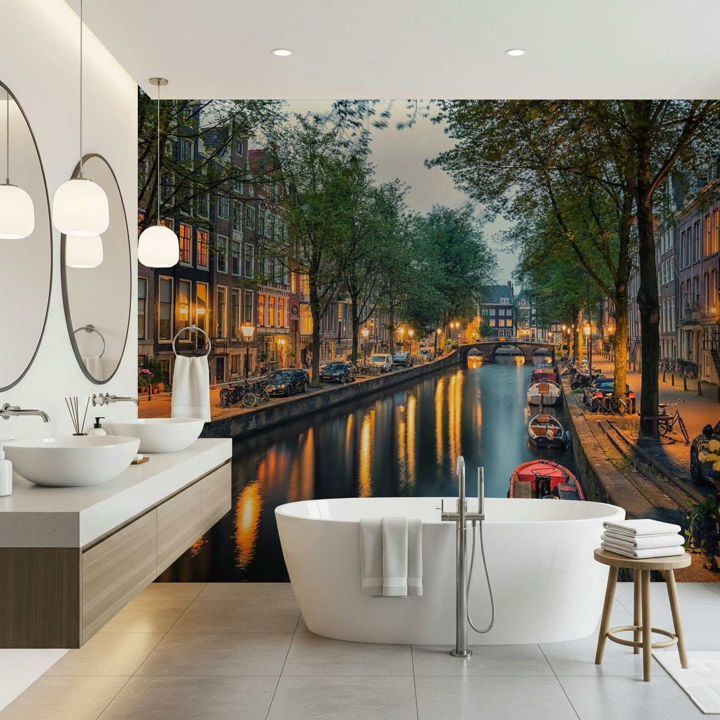 Amsterdam Canal Lights wallpaper mural of a lamplit canal behind a freestanding white tub and vanity in a bathroom