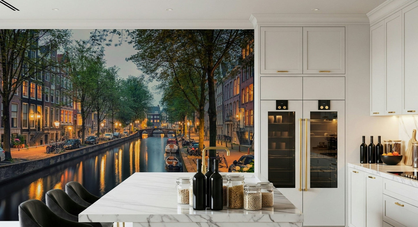 Amsterdam Canal Lights wallpaper mural of a dusk canal beside a white marble island in a modern kitchen