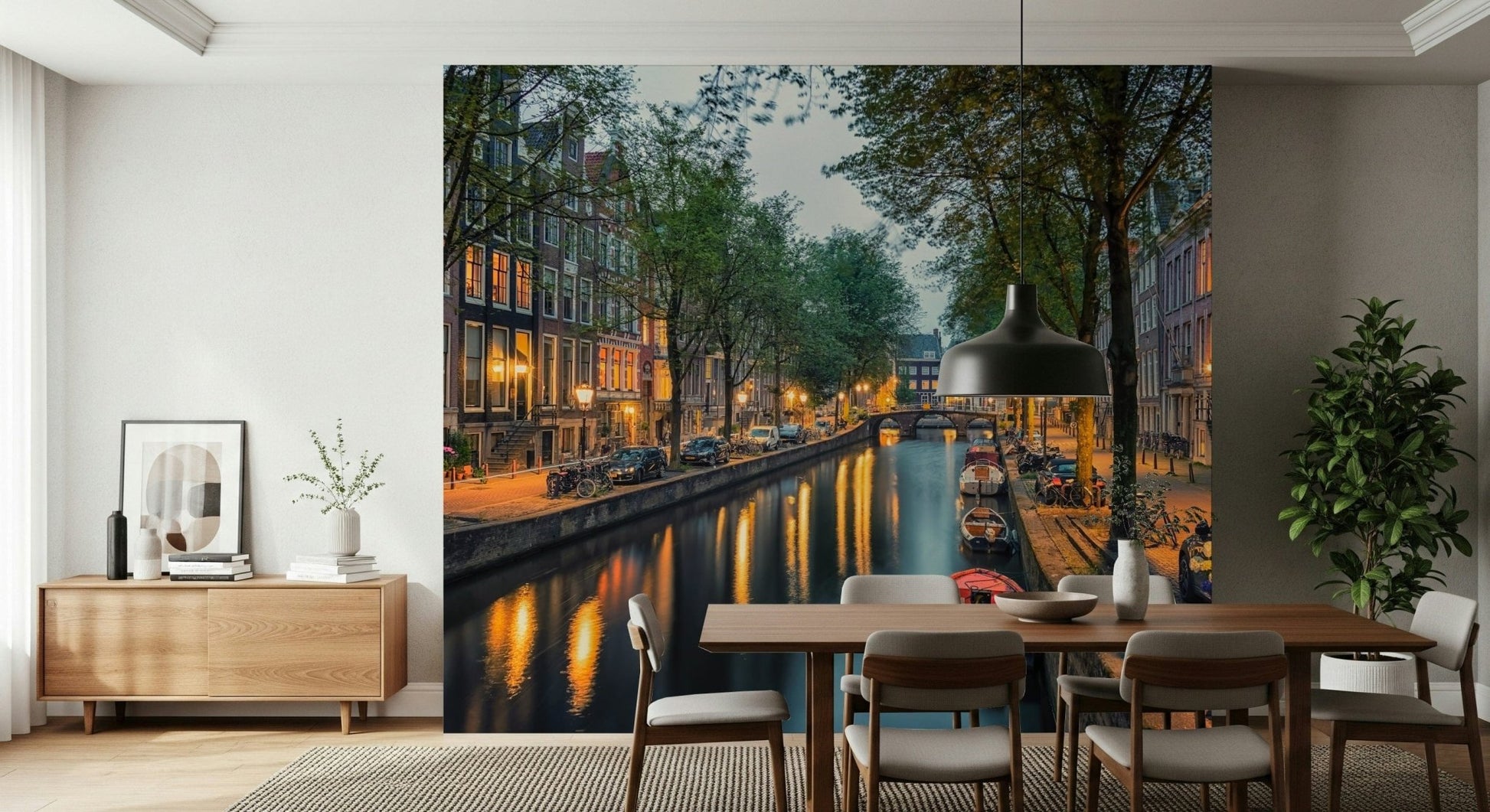 Amsterdam Canal Lights wallpaper mural of a glowing canal behind a wood dining table and black pendant in a dining room