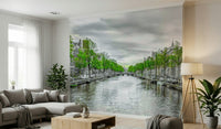 Amsterdam Canal Serenity wallpaper mural of a canal with moored boats behind a gray sectional sofa in a living room