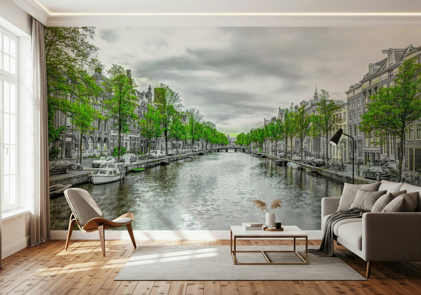 Amsterdam Canal Serenity wallpaper mural of a green-trimmed canal behind a gray sofa and wood chair in a living room