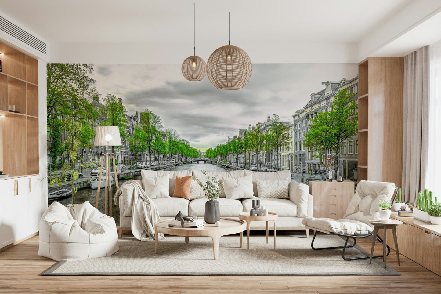 Amsterdam Canal Serenity wallpaper mural of a tree-lined canal behind a white sofa and woven pendant lights in a living room
