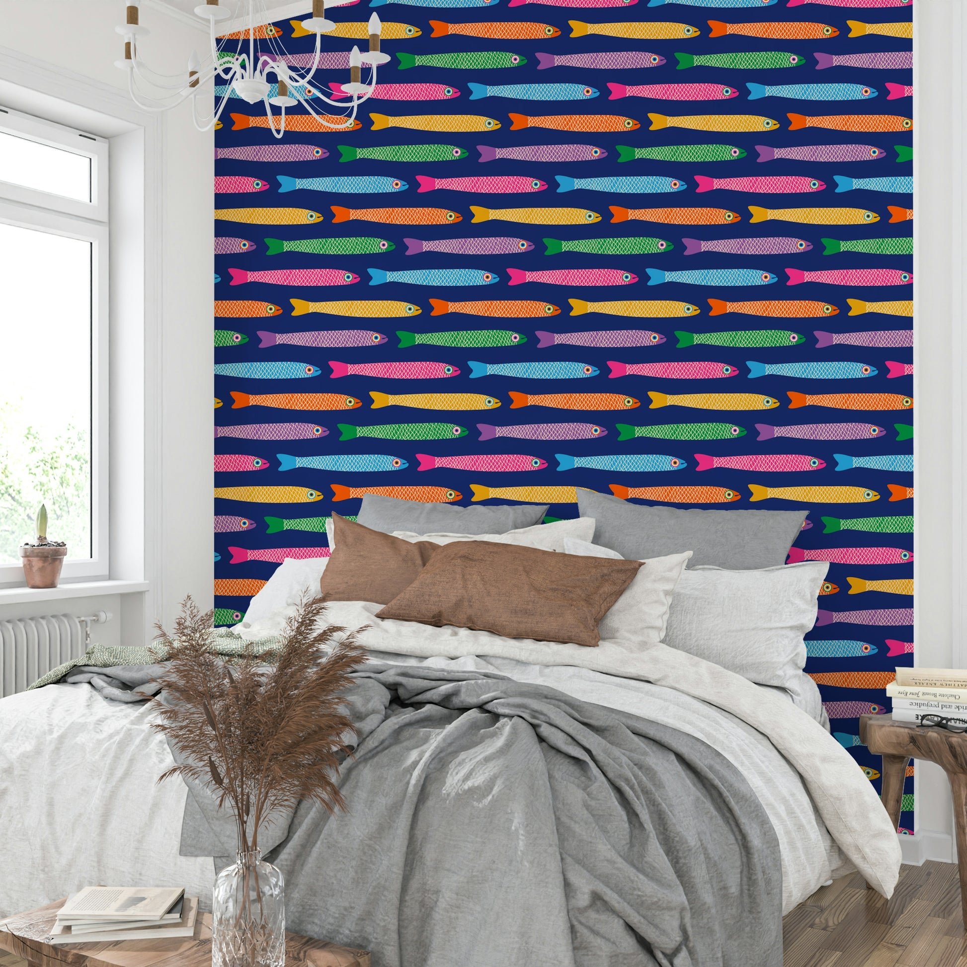 Rainbow fish swimming across royal blue wallpaper for a joyful look.

